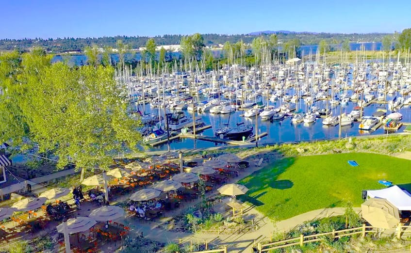 Ariel view of the uplands at Tomahawk Bay Marina on Hayden Island in Portland Oregon, seating, greenspace, medows, and marina docks.