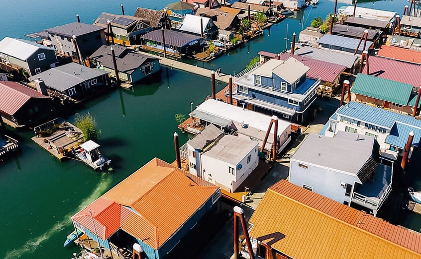 An aerial view of homes Floating At Island Cove Marina in Portland Oregon